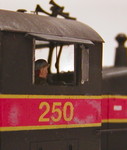 Interior detailing in the Cannon cab included a fire extinguisher, control stand bracing, a Cannon electrical box, brakestand and wheel, and horn cord.  However, due to the glare on the windows, the latter two items are about the only ones still visible after final assembly.  The horn cord is just in front of the engineer's face in this view.  Unfortunately, the rear headlight wires are the most visible items in the cab. :-(