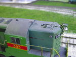 Closeup of modified roof details.  The antenna conduit was cut shorter, and the whip-style antenna was replaced with a new Sinclair, which was mounted overhanging the front edge of the cab so the wiring to the remaining portion of the conduit wouldn't have to be routed through the cab roof.  Also, a toilet vent was added to the side of the short hood.  I believe the prototype's weld seam on the cab roof appeared after the short hood was replaced, early in her IAIS career.  And yes, the prototype's horn and grab iron are mounted backward. :-)