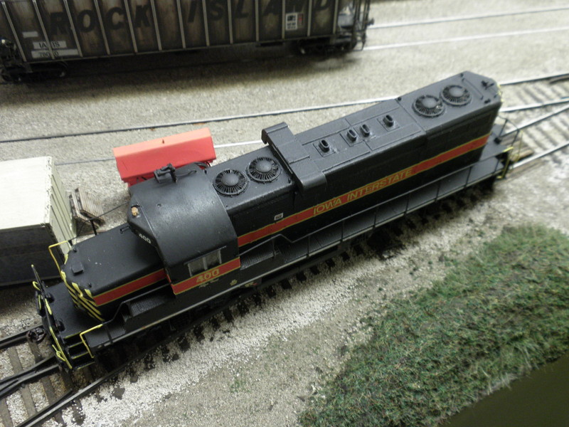 The GP7 shell I started with had dynamic brakes, so I cut those out and replaced them with a Front Range GP7 non-DB hatch I had on hand, shimmed with styrene. The engine room access hatches are Evergreen .010" styrene.