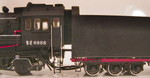 Cab view showing new numbers, touched up handrails, step edges, and trailing truck trim, and red Chinese characters on the tender axle journals.  The Chinese characters on the cab and the rear of the tender are a combination of decal pieces and handpainting.