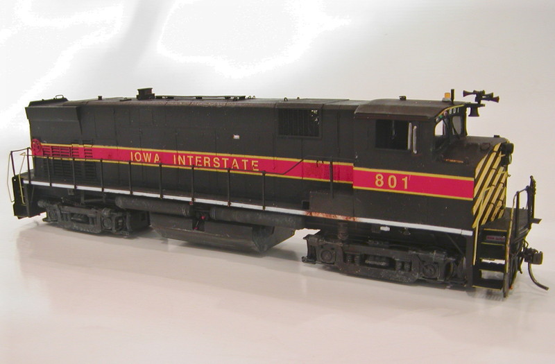 Engineer's side of IAIS 801.  This model was built from a Kaslo M420R shell on a heavily-modified Atlas U23B drive.

Handrails were bent from wire stock, and the stanchions were from the Kaslo kit.  However, I used extra stanchions, doubling them up at each location to give a more prototypical profile.

A warning to anyone building the Kaslo kit:  The handrail templates included in the instructions, while close to HO scale, are slightly too small, making them unusable.