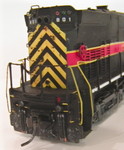 Long hood end, showing chipped yellow striping and missing red class light lense on left side, based on prototype photos.  Class lights are MV 0.052" lenses.  Details West #172 step lights were added to each step well and above the front truck on both sides.  The front and rear drop step chains are cut from Detail Associates #2210 safety chain.

I realized when uploading these pics that I'd forgotten to add the headlight and ditch light lenses.  Those will be done tonight so 801 can be placed in service.