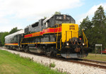 IAIS 712 pulls business car "Hawkeye" east through Stockton, IA on 26-Jul-2006.