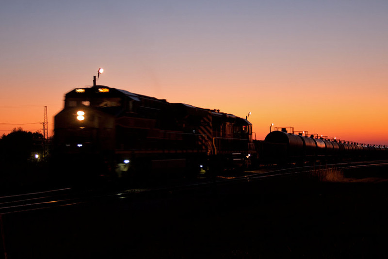 IAIS 509 West was the first detour over the BNSF and is leaving Silvis before sunrise.