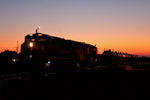 IAIS 509 West was the first detour over the BNSF and is leaving Silvis before sunrise.