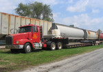 IAIS Volvo semi-tractor with flatbed trailer sits in Stockton, IA on 18-August-2005 during a crossing replacement project.