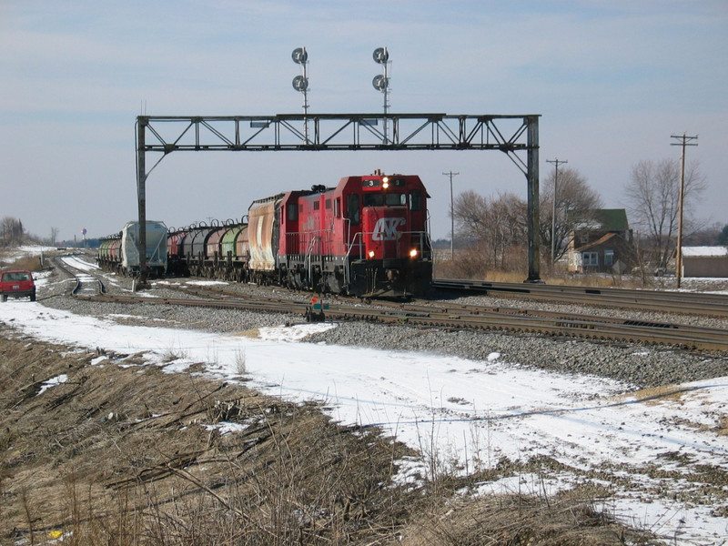 Looking west at Zearing yard and the eastbound home signal for the Zearing crossovers; Malden is in the background.  Feb. 13, 2006.