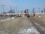 BNSF autorack train passes while the Ill. Railnet crew switches the yard.  Feb. 13, 2006.