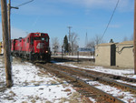 Railnet power at the station sign; in the background is the BNSF main.  Feb. 13, 2006.