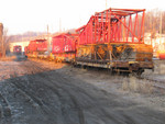 Manitowoc track crane loaded on several flatcars at La Salle.  In the background are the Railnet's CF7s.  Feb. 14, 2006.