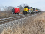 The crew has just dropped off the two paper boxcars on the Midwest Color spur at Marengo, and is backing eastward down the siding onto their train.  Dec. 18, 2006.