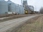 Westbound passing the Marengo elevator while an employee continues loading grain cars.  Dec. 18, 2006.