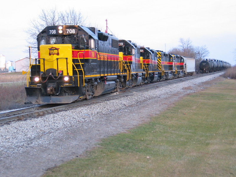 Power for the Cedar Rapids job is backing into the west end of Homestead siding while the crew picks up empty ethanol storage tanks.  Dec. 18, 2006.