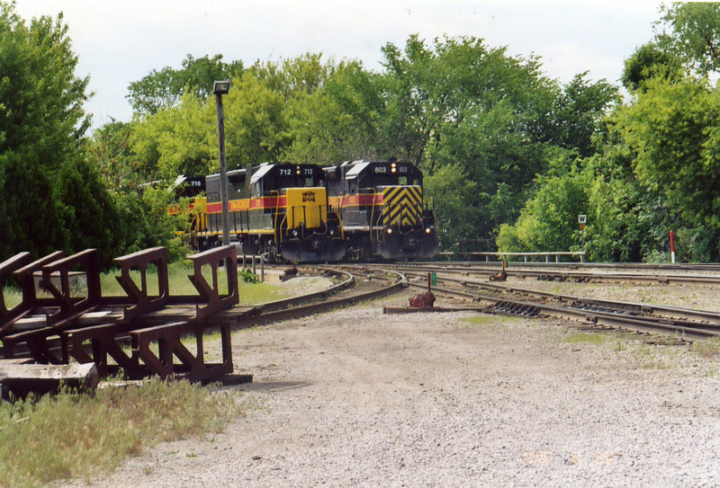 The east train swaps power in Iowa City.  Outbound power on the left, inbound on the right.  May 25, 2005.