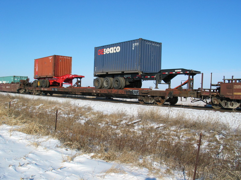 Cool pigs.  I see these occasionally on the westbound; I don't know what's in the boxes but it must be heavy!