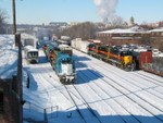 The RI crew pulls east through Iowa City yard on the siding with the east train, after spotting their inbound power to the house and digging out 3 outbound geeps.  In the background, the Newton crew is getting their power lined up west of the house.  The west train (with the loaded bulkhead flat) sits on the main.