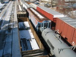 Coil car and NRI hopper on the eastbound, sitting on the siding.