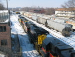 Looking west from Dodge St.  The hoppers parked on #1 track are mtys, I suspect left there by the CR job this morning, that the WB crew will take with them.