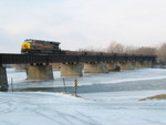 Eastbound bare table train crosses the Cedar River at Moscow, Jan. 7, 2009.