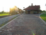 About what you'd expect shooting straight into the sun, BN coal detour passes the depot at West Lib., July 21, 2010.