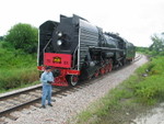 After running west of Stuart to the Wausau spur, the 700 pulled the train into the spur, and the steamer backed up on the main to switch ends.  This view looks eastward at the steamer parked on the main.