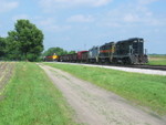 West train approaches the west end of N. Star siding, while the ballast train holds after pulling out and backing east on the main.