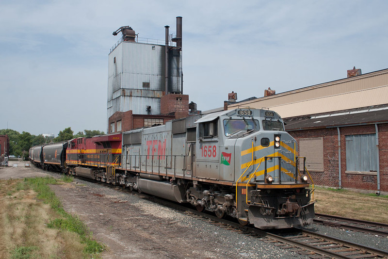 A loaded KCS grain train detour heads for the CP on the Golden State Route at 1st Street in Davenport, IA.