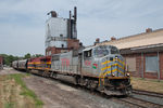 A loaded KCS grain train detour heads for the CP on the Golden State Route at 1st Street in Davenport, IA.