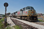 An empty KCS grain train from the CP heads east towards Rock Island through downtown Davenport, IA on August 2, 2011.