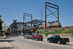 An empty KCS grain train off the CP exits the Government Bridge into Rock Island, IL on August 2, 2011.