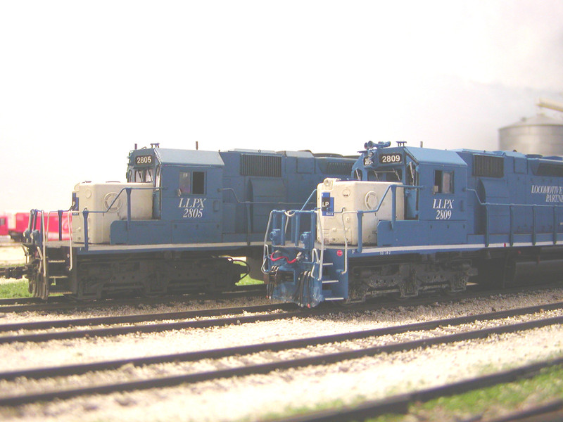 LLPX 2809, still missing jewels for the ditch lights and rear Gyralight, poses with the 2805.  I bought the latter model from Dan Risdon, renumbering it, altering a few details, and adding more weathering to represent the 2805.