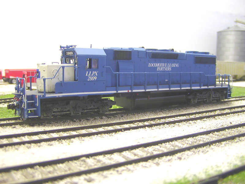 After buying another LLPX SD38-2 from Dan Risdon and being much happier with his choice of blue (Testors #1110 Blue), I decided to strip and repaint/decal/weather the 2809.  Here's the latest iteration.