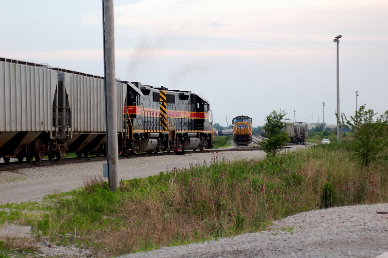 IAIS westbound BICB meets UP's eastbound DMPR in Newton yard, June 11, 2008.  Photo by Larry Hamilton.