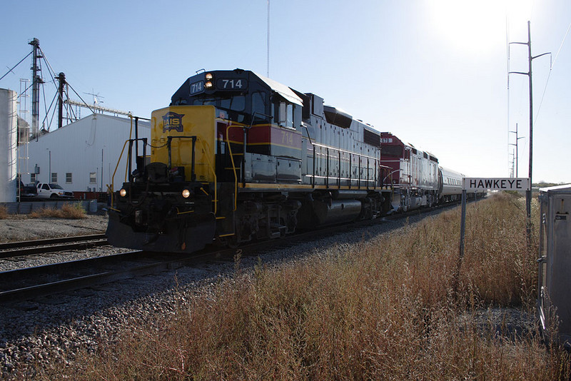 A special train hosting a trip for the Lexington Group heads west through Hawkeye, IA.  IAIS 714 led IANR 678, 3 Amtrak "Amfleet" coaches, and IAIS business car "Hawkeye."  14-Oct-2006.