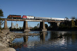 A special train hosting a trip for the Lexington Group heads west over the Iowa River in Iowa City, IA.  IAIS 714 led IANR 678, 3 Amtrak "Amfleet" coaches, and IAIS business car "Hawkeye."  14-Oct-2006.