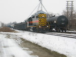 Spotting a tank car at Frantz Dust Control.  Looking west at the Wilton house track.