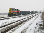 Looking west, the local is pulling into Norfolk's siding.