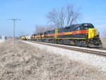 East train passes the turn parked at N. Star siding.  How about that 4 geep consist!