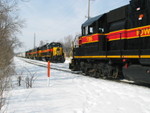 West train heads in at 1st Ave. while the eastbound RI turn holds the main.