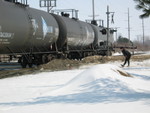 A 1st Ave. jogger stretches out while waiting for the alcohol tanks to clear.