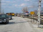 Inbound Metra passes waiting extra BI switcher power at Vermont St.