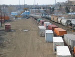 Looking south from 127th St., the Chicago Rail link is shoving cars north into their yard while a westbound Werner trailer is loaded.