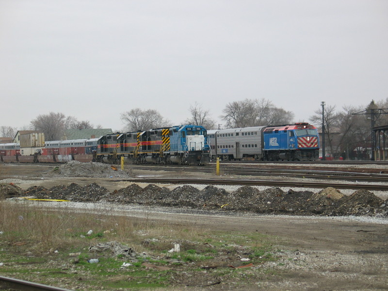 Outbound Metra passes the Westbound IAIS road freight at Blue Island Vermont St., March 27, 2007.