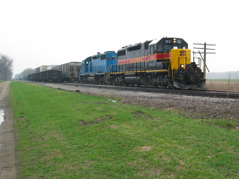 West train at N. Star, March 31, 2007.  The crew has just set out 4 scrap loads and is backing onto their train.