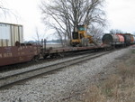 Company service road grader going east.