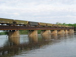 Coal empties head east across the Cedar River, May 10, 2007.