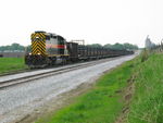 The crew is done laying rail and is pulling west on the main past the new west end of Earlham siding.