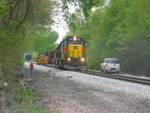 Setting the ballast cars into the east end of the pocket, while the track foreman holds the main with the tamper.