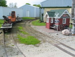 That's a CNW bay window caboose behind the "depot."