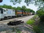 East train heads east on the main.  Almost the entire train of 15-20 cars was scrap, with a couple covered hoppers for I think JM.